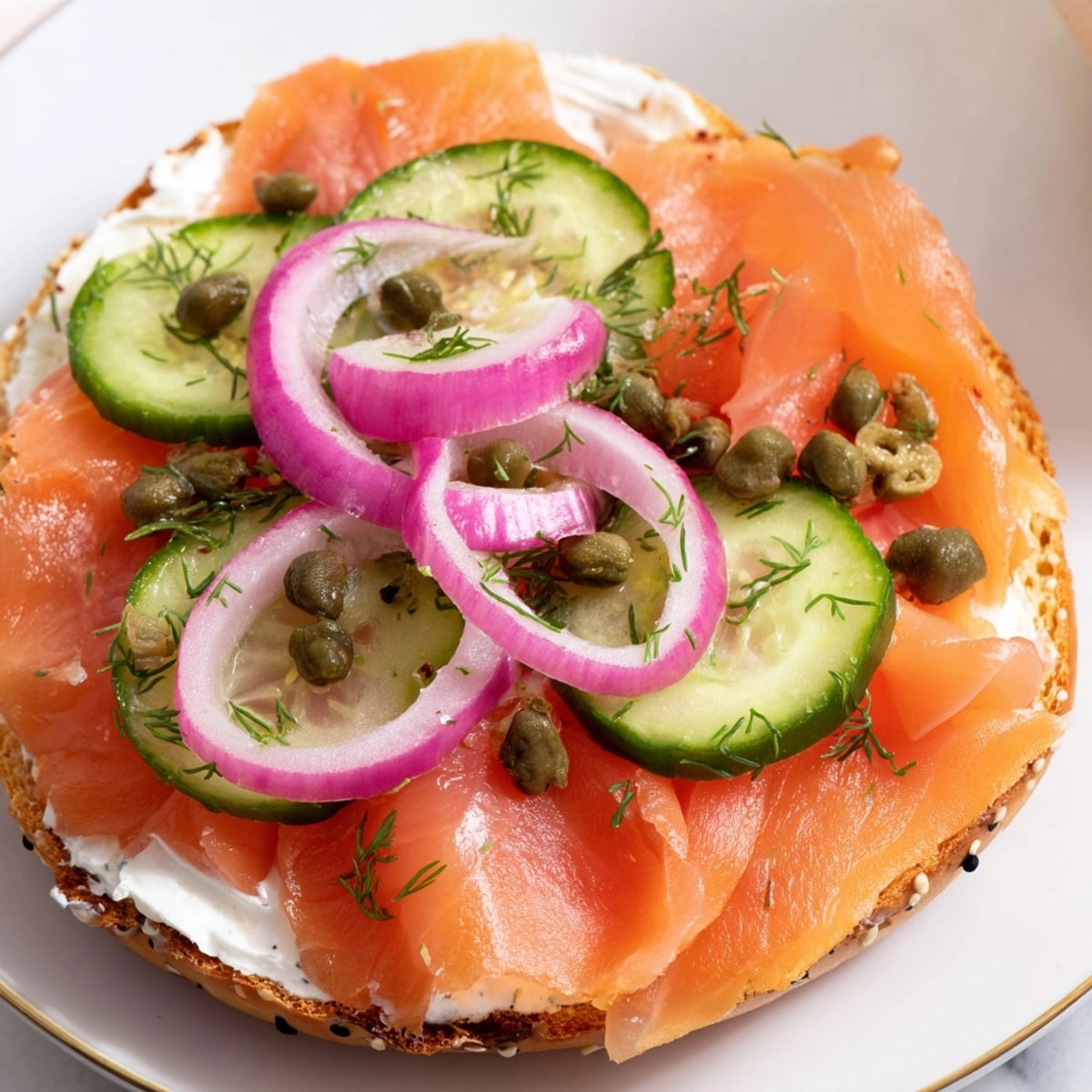 Preparing smoked salmon and dill bagel sandwiches: creamy, salty, fresh, and beautifully arranged.