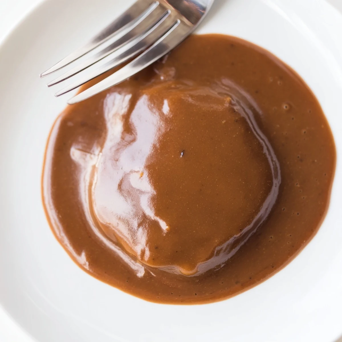 Close-up of creamy, flavorful homemade beef gravy, perfect for spooning over mashed potatoes or roast.