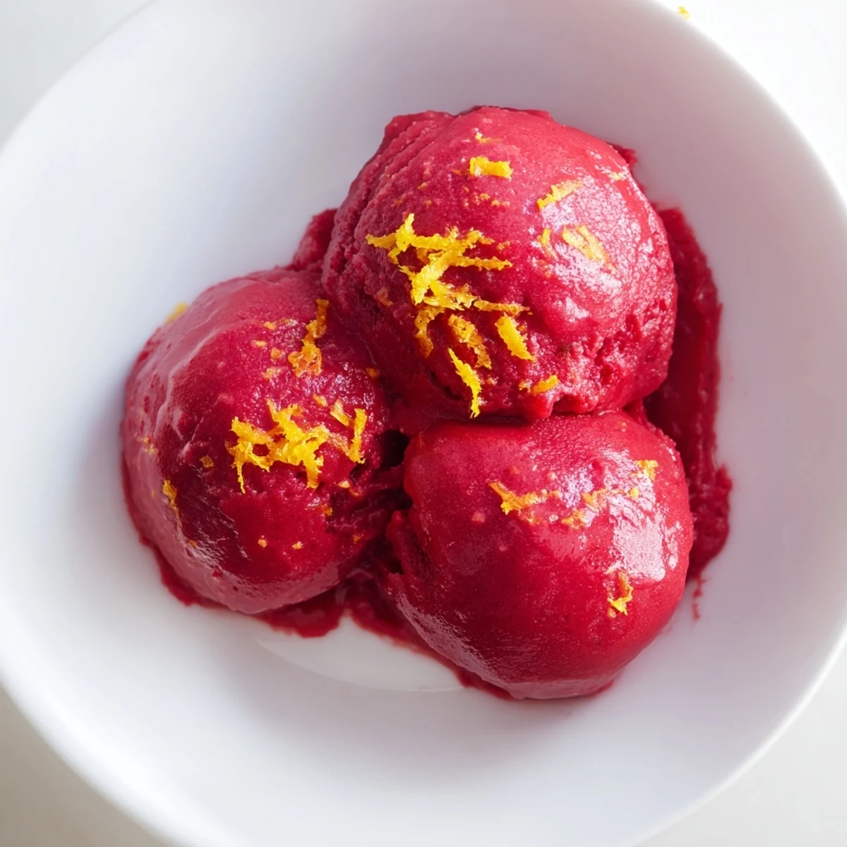 Vibrant red Cranberry Sorbet, a refreshing frozen dessert with a tart, sweet flavor.