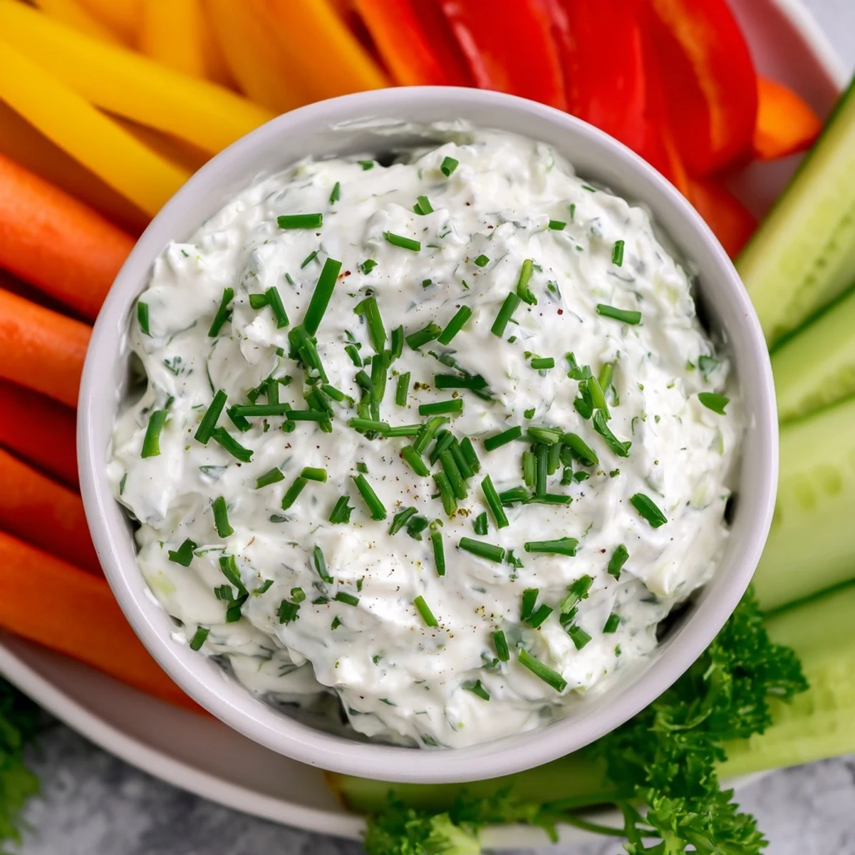 Easy-to-make Kids Dip: Cream Cheese and Ranch Dip, served cold with fresh, appealing vegetable sticks.