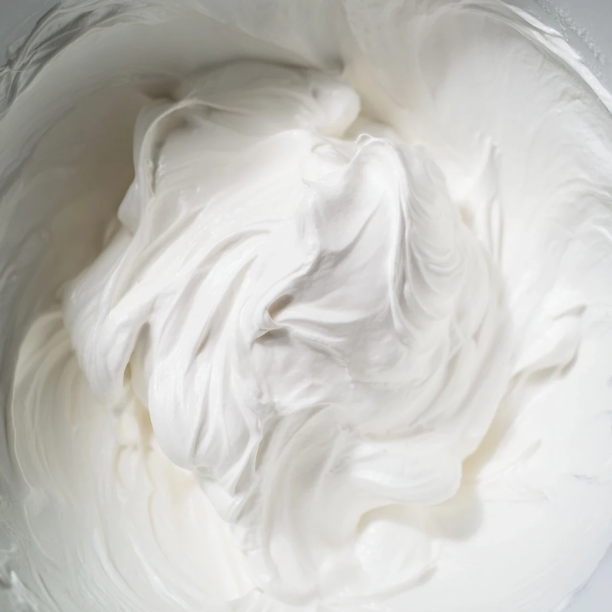 Fluffy white gingerbread house icing, perfect for building and adding creative details to your home.