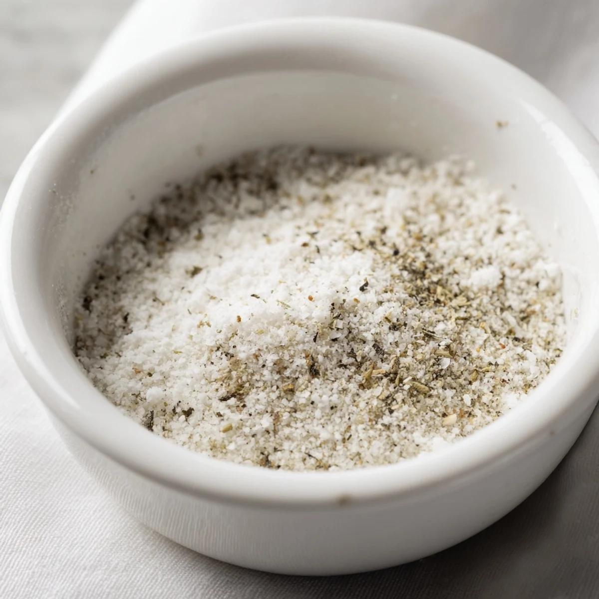 A close-up of Garlic Powder Seasoning ingredients blending, offering a savory, aromatic experience.