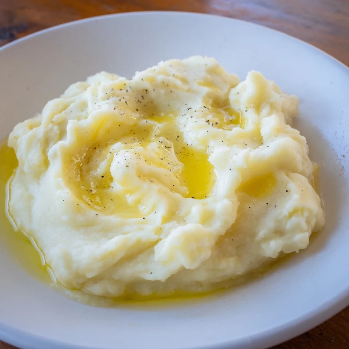 Golden, buttery mashed potatoes, a classic American comfort food for Thanksgiving or dinner.