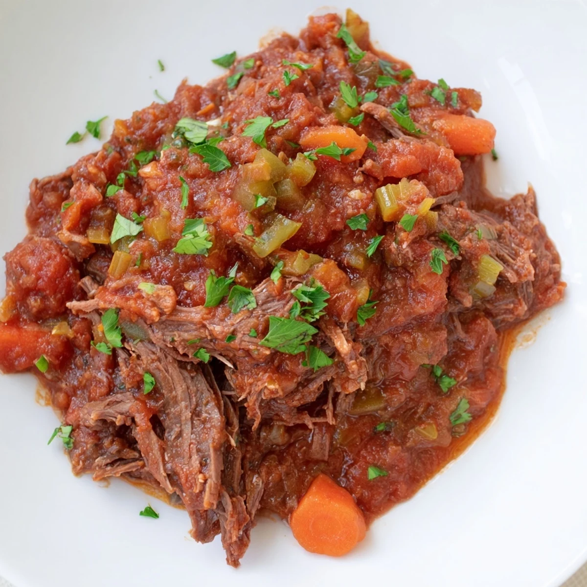 Fragrant slow cooker beef ragu, with tender beef and rich tomato sauce, ready for serving tonight.