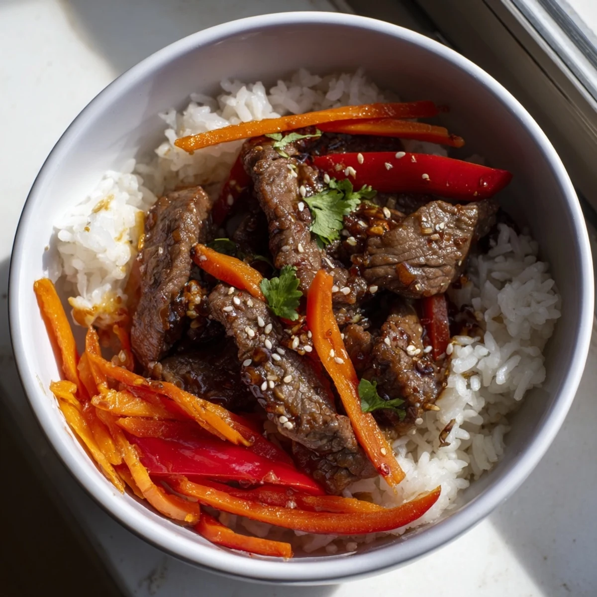 Steamed jasmine rice and colorful vegetables make this Beef Lunch Bowl perfect for lunch.