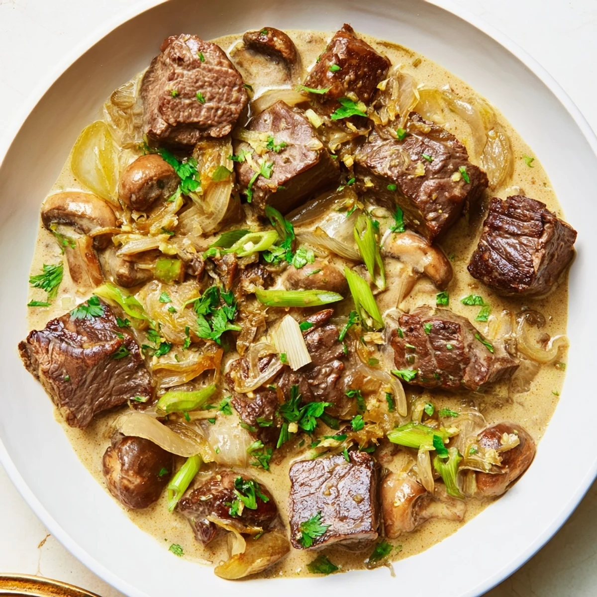 Steaming Lemongrass Coconut Braised Beef with Mushrooms served in a rustic bowl.