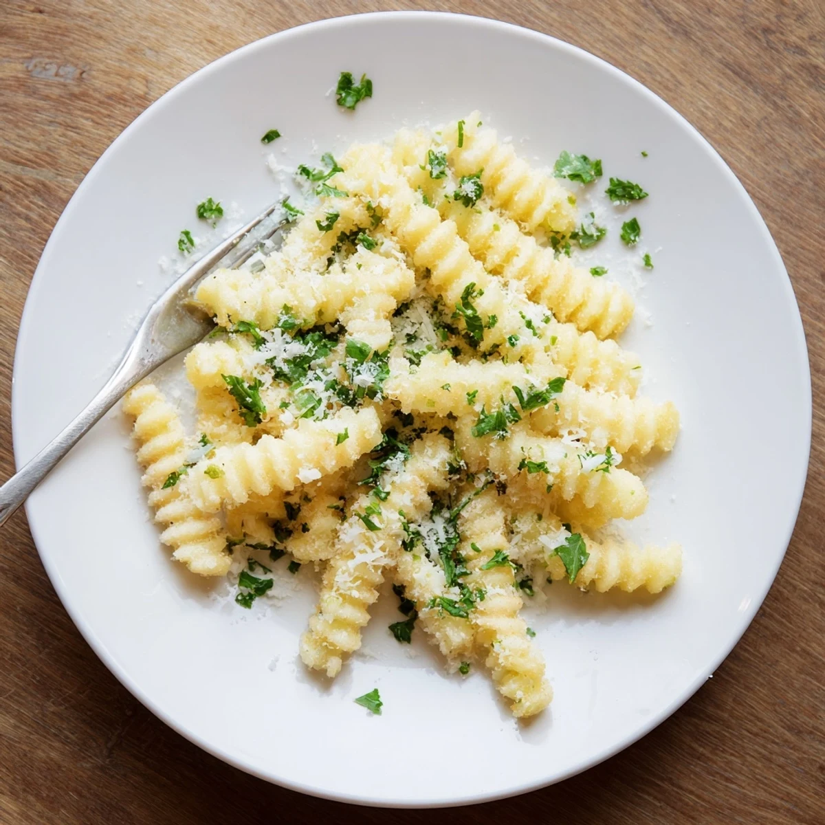 Crispy Mashed Potato Fries are golden brown sticks of fluffy potato, served hot with a dipping sauce.