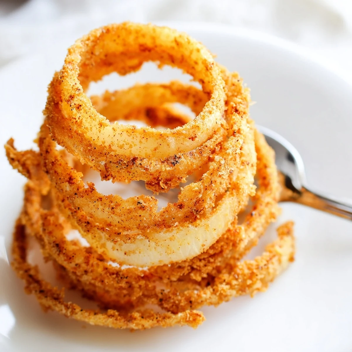Thin sliced onion rings fried until perfectly crunchy and golden brown