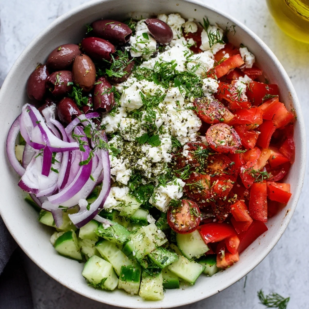 Protein-packed Greek salad cottage cheese bowl featuring crisp cucumbers, juicy cherry tomatoes, and tangy feta cheese
