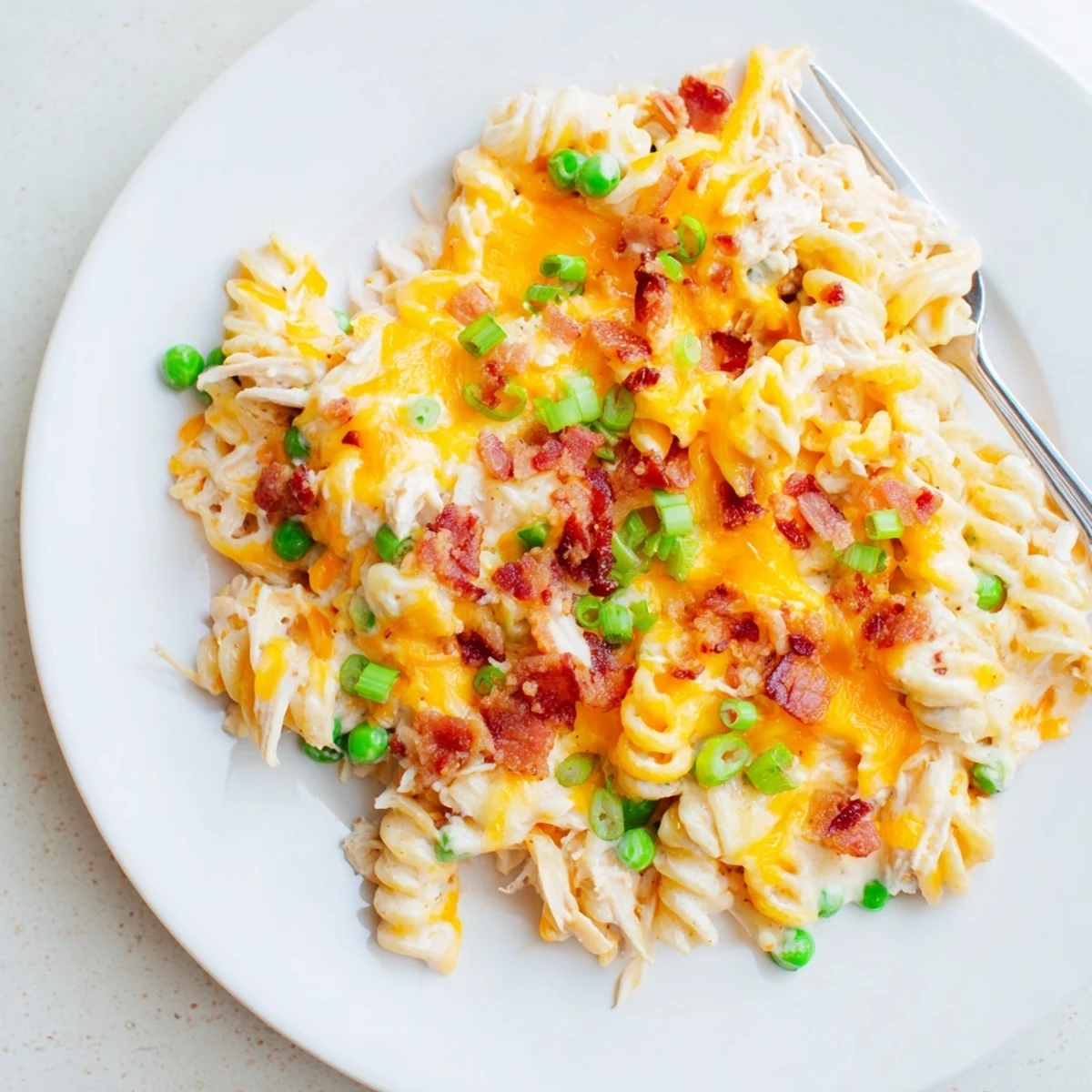 Slow cooker Crack Chicken Casserole featuring tender pasta in a rich ranch cheese sauce