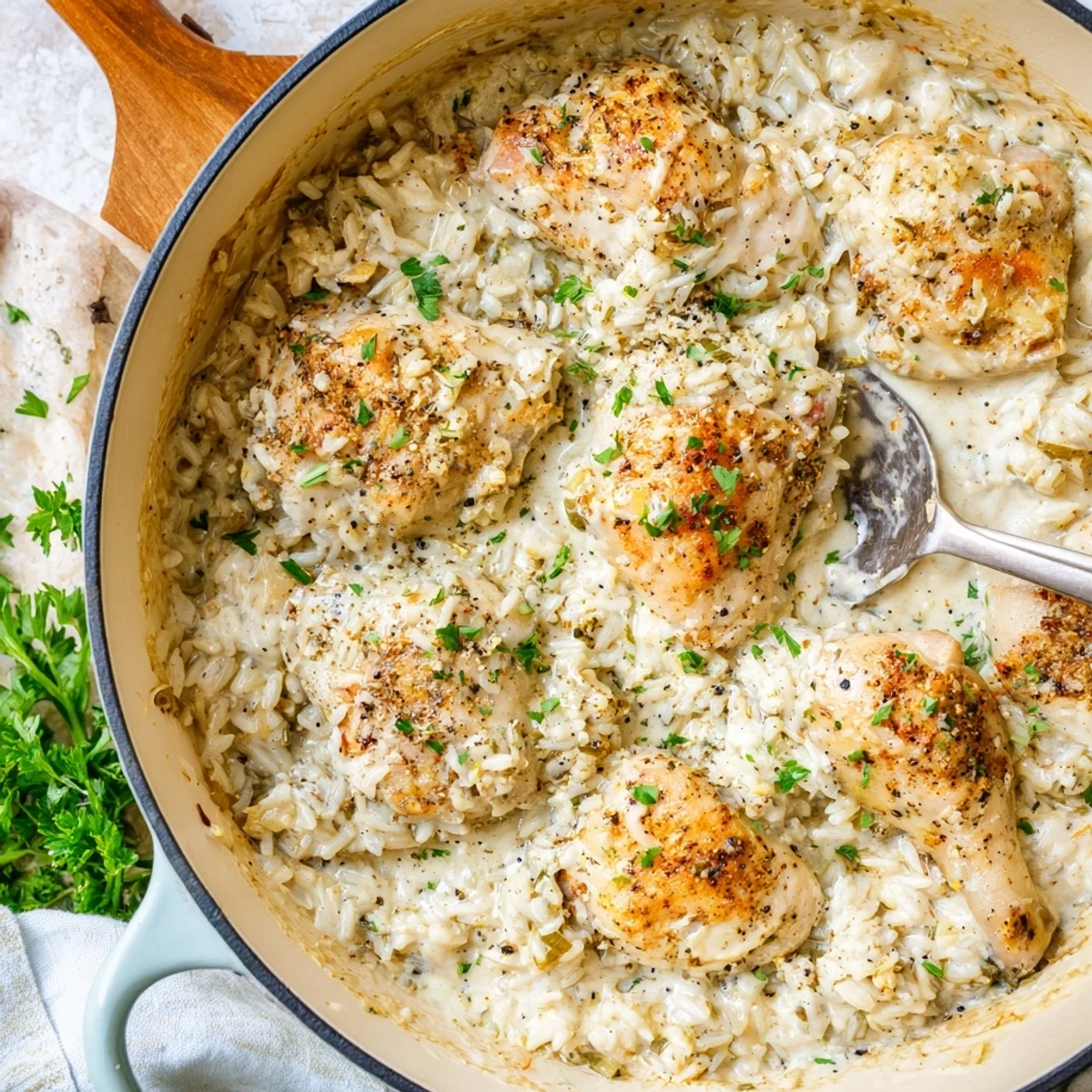 Golden one pot angel chicken rice bake with creamy parmesan sauce and tender chicken pieces