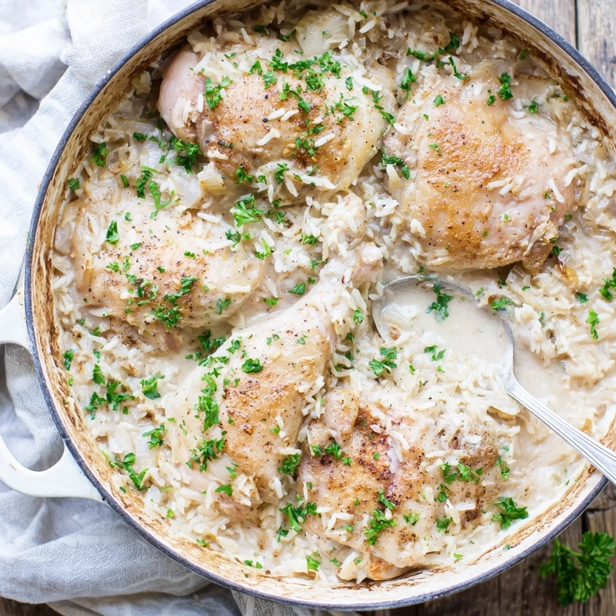Baked one pot angel chicken rice casserole featuring juicy chicken breasts and rich white sauce