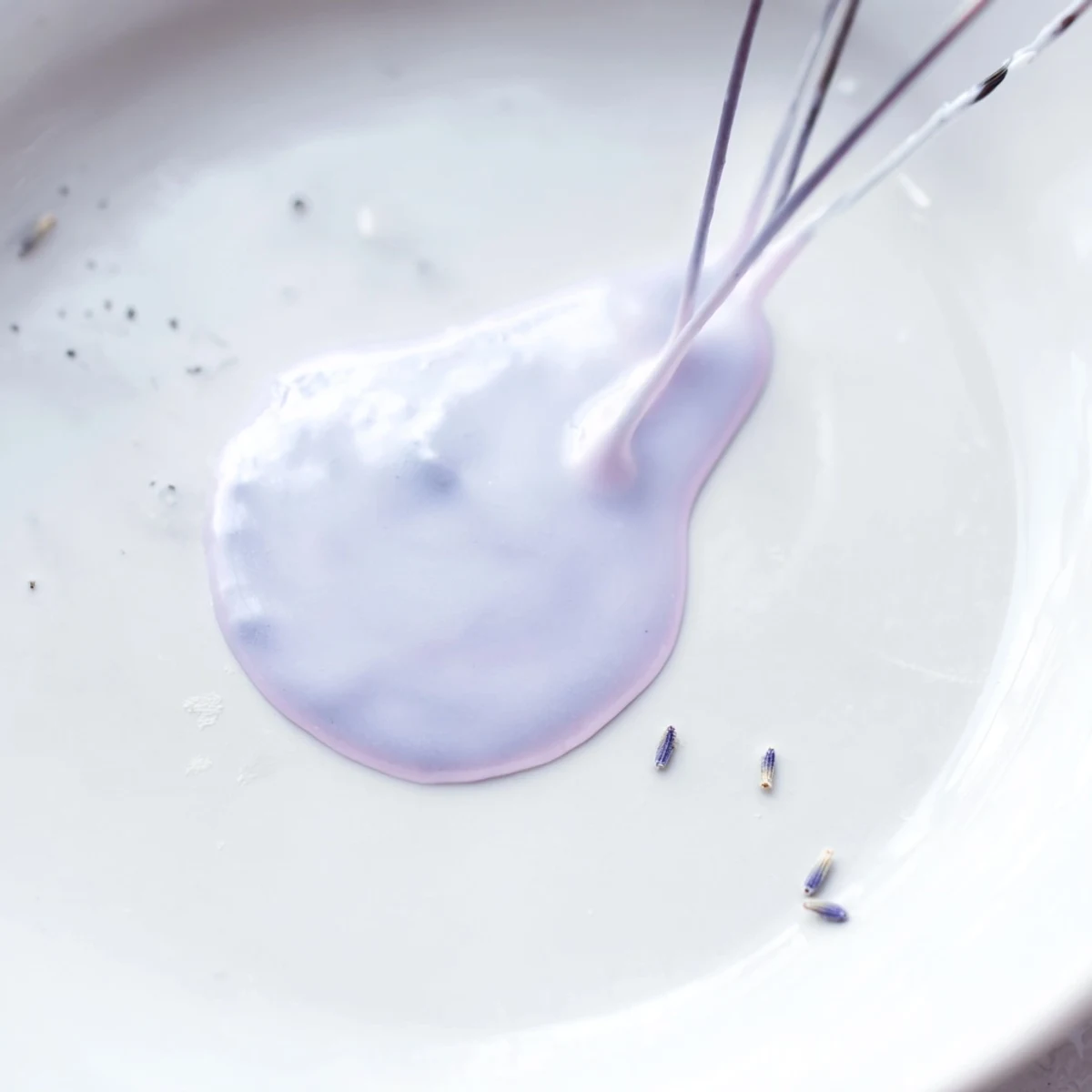 Purple-hued lavender glaze drizzled elegantly over vanilla scones with delicate floral aroma