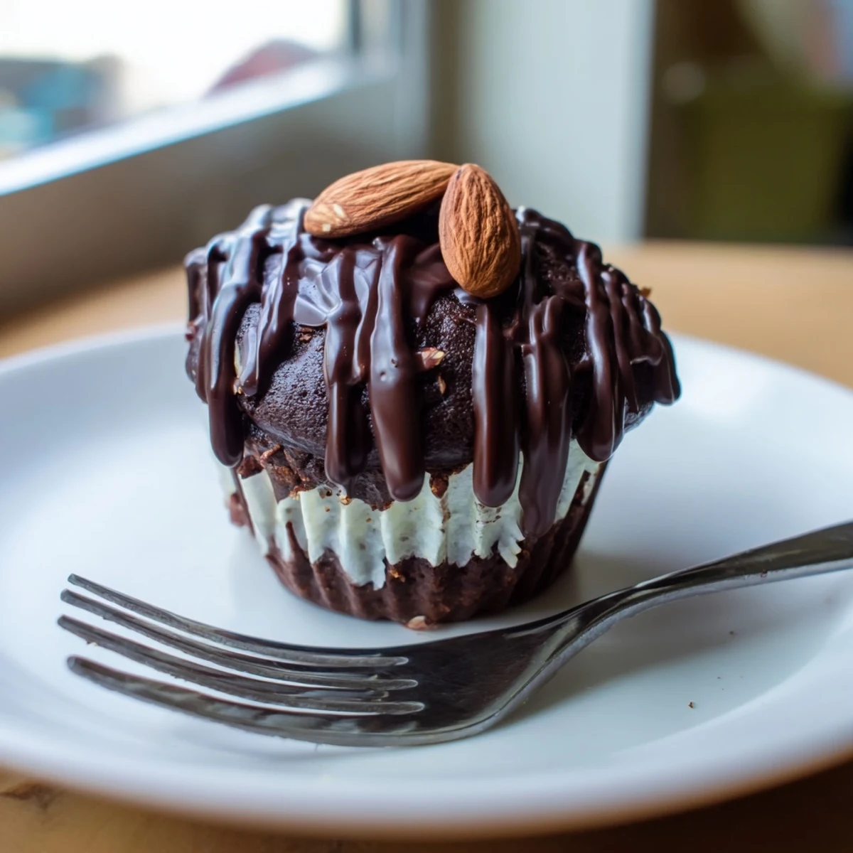 Decadent flourless almond joy cupcakes with gooey coconut centers on a rustic wire cooling rack