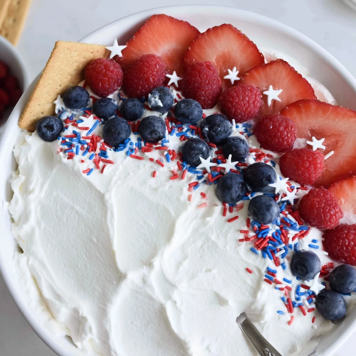 How To Make Star Spangled Cheesecake Dip creamy, berry-topped, served with graham crackers.