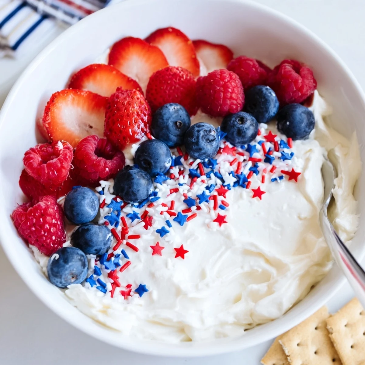 Star Spangled Cheesecake Dip chilled, fluffy, perfect for dipping with vanilla wafers.