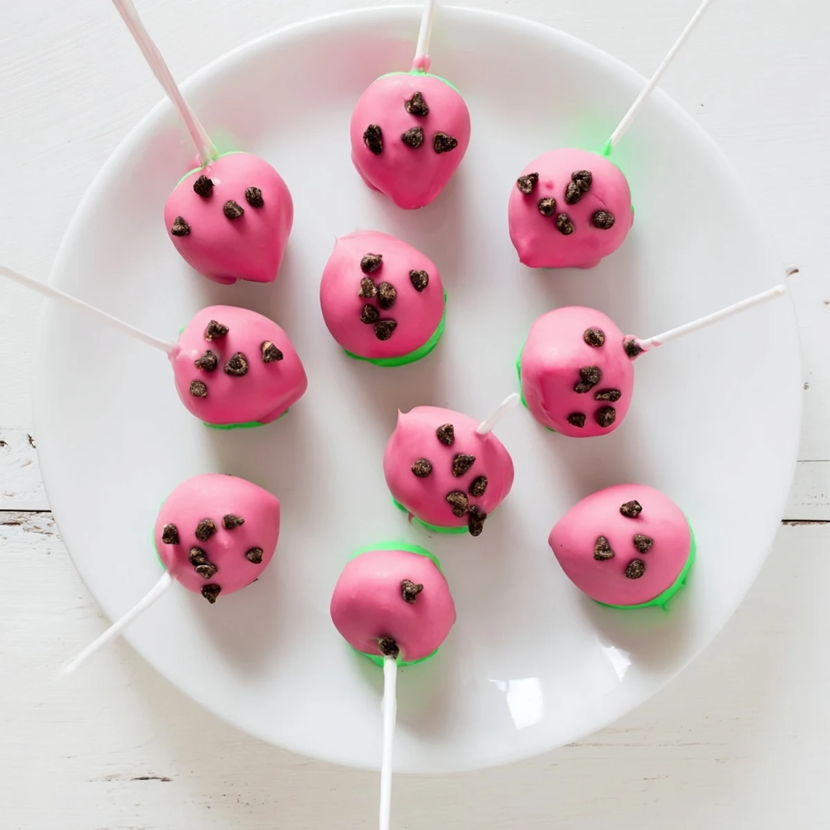 Bite-sized watermelon cake pops on sticks ready for summer party dessert display