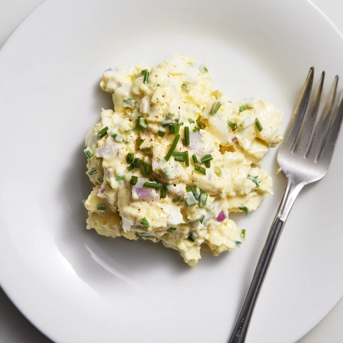 A chilled Classic Egg Salad Recipe in lettuce cups, tangy mustard bite