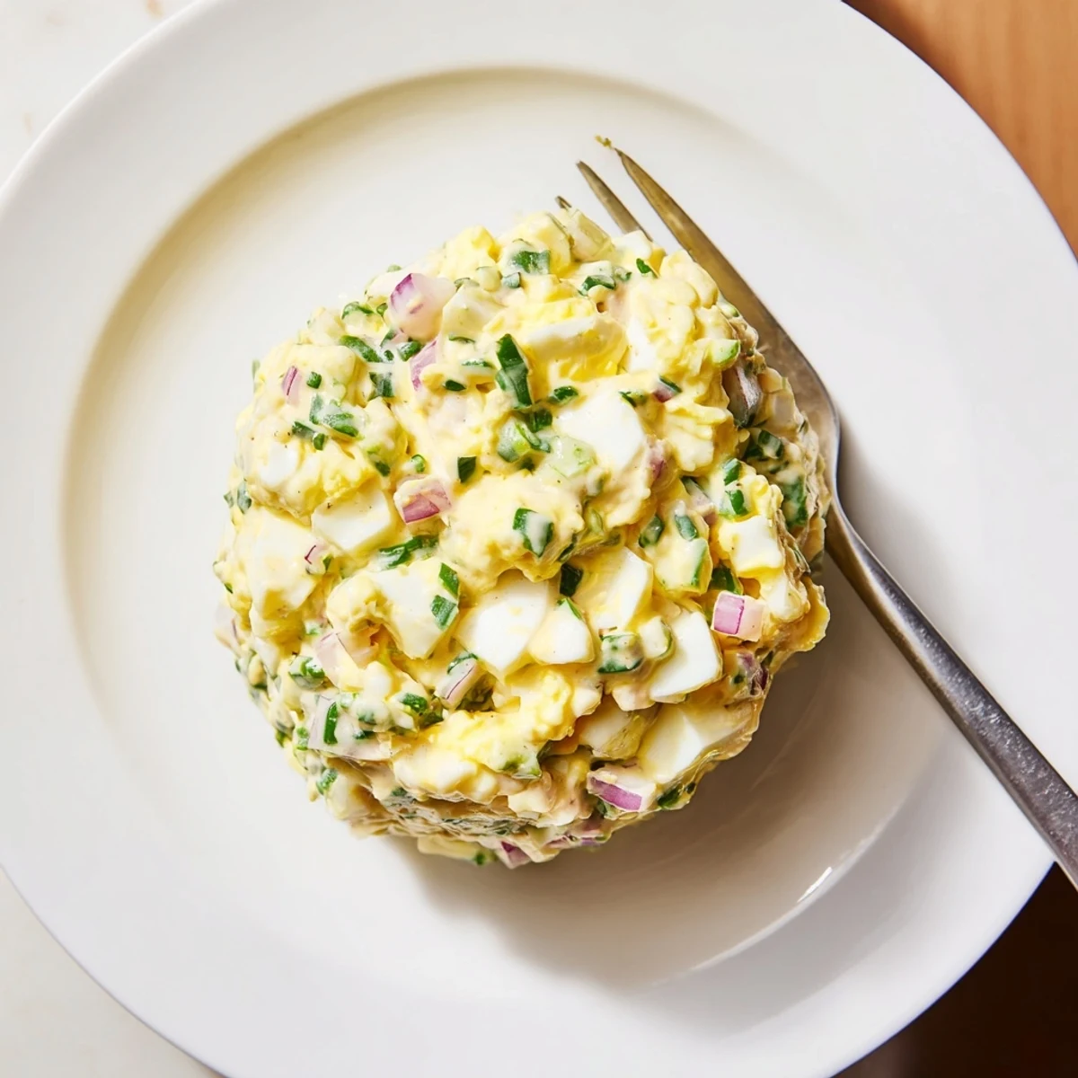 Close-up of Classic Egg Salad Recipe, chunky yolks, creamy mayo, paprika dusting