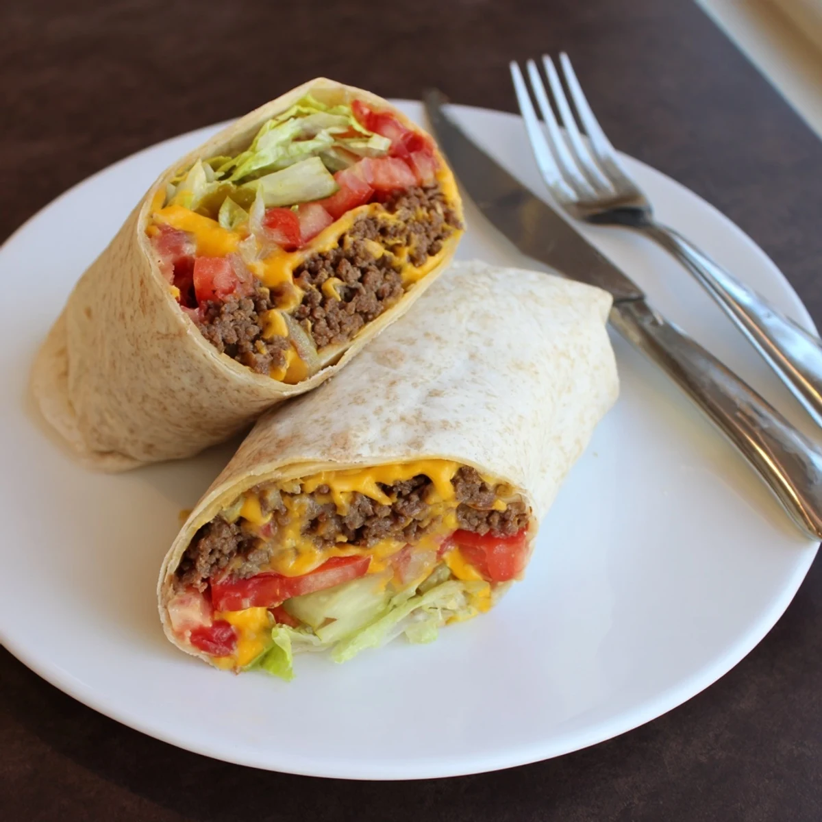 Quick plate of juicy beef, shredded lettuce, pickles—classic Cheeseburger Wrap Recipe.